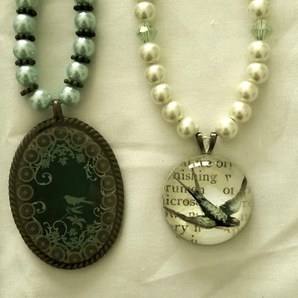 Two bird necklaces